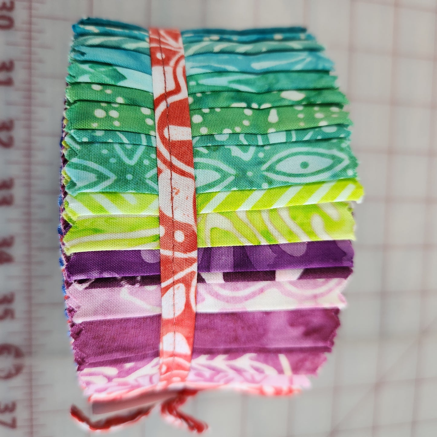 Calypso Batiks Jelly Roll by Kate Spain for Moda